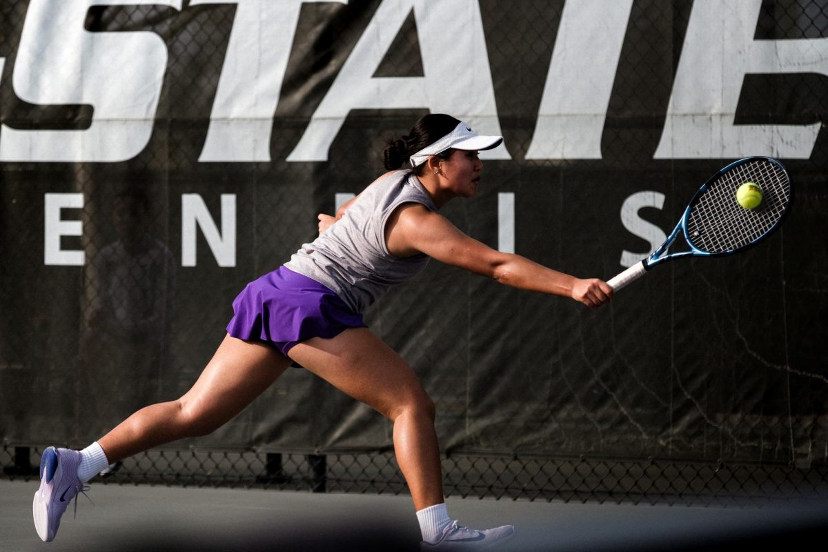 K-State Tennis player Martaa Chogsomjav dives to volley the ball during a singles match against Wichita State at the Mike Goss Tennis Stadium on Feb. 13. 