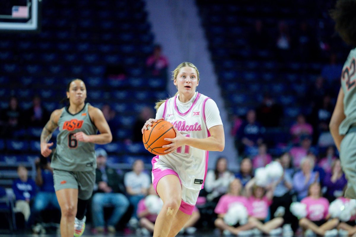 Taryn Sides moves the ball down the court, looking for an open teammate to pass to. The 'Cats defeated the Cowgirls 70-61 at home on Feb. 10.
