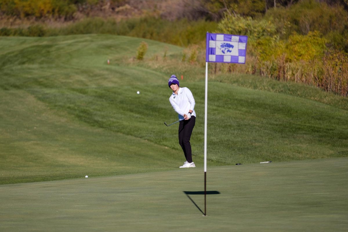 K-State Golfer Kelsey Chen chips the ball toward the green at the Powercat Invitational on October 20, 2025. Chen finished tied for sixth after the first of two days at the event.
