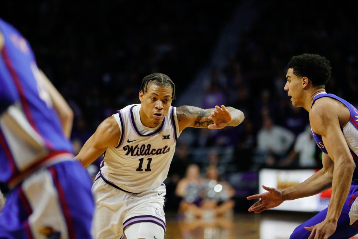 Driving to the hoop, senior forward Keyonte Johnson keeps a KU player out of his way. K-State mens basketball played the University of Kansas Jayhawks on January 17, 2023. K-State beat KU 83-82 in overtime in a sold out Bramlage Coliseum. (Macey Franko | Collegian Media Group)