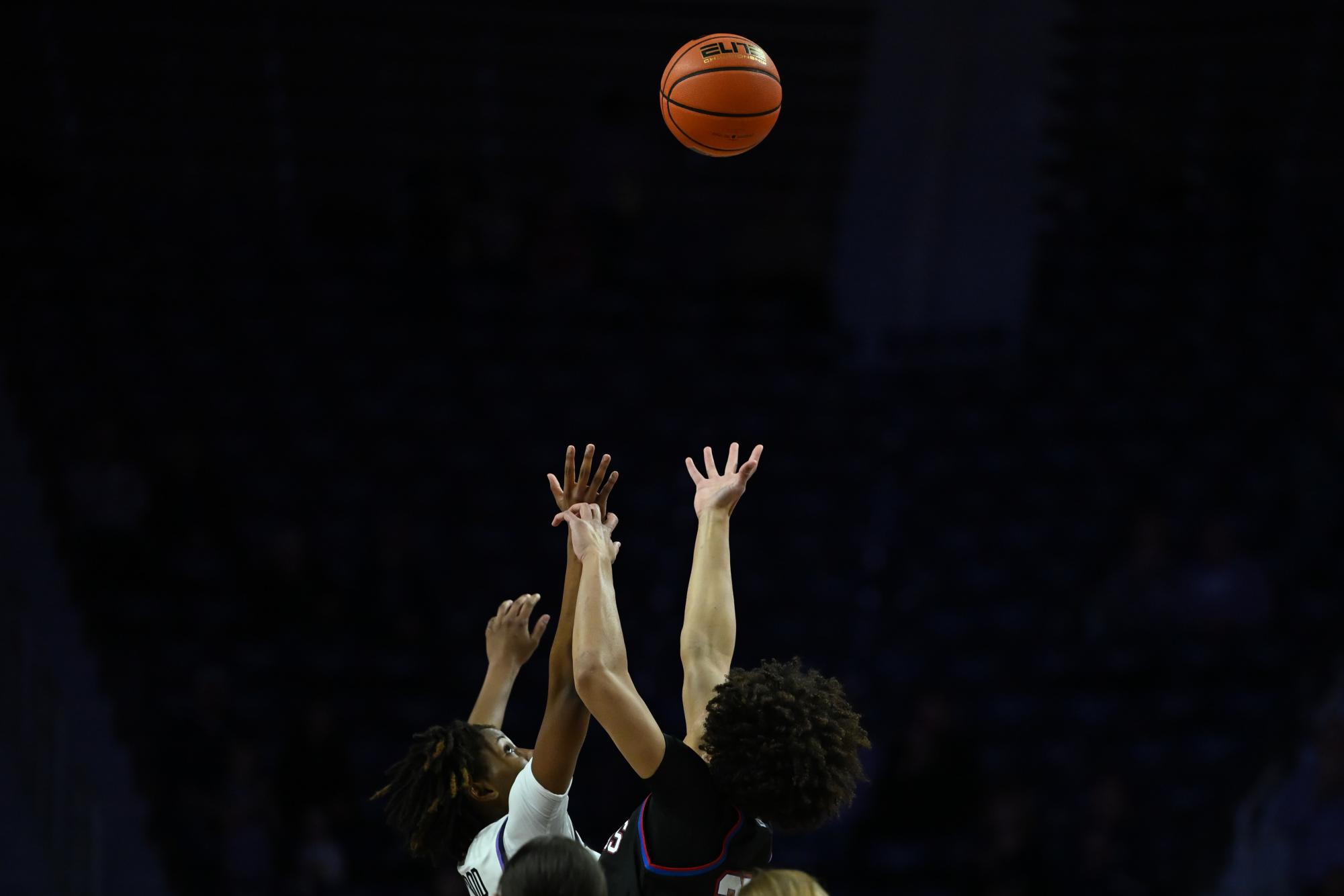 Brandie Harrod goes up for the jump ball to kick off the Sunflower Showdown at Bramlage Coliseum on Feb. 21. 
