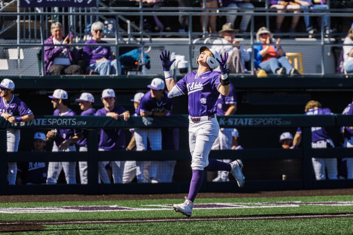 Designated hitter Micah Kendrick (18) shows his excitement after hitting a home run against SIUE on March 8. Kendrick had two home runs on the day, helping K-State in a 20-7 win. 