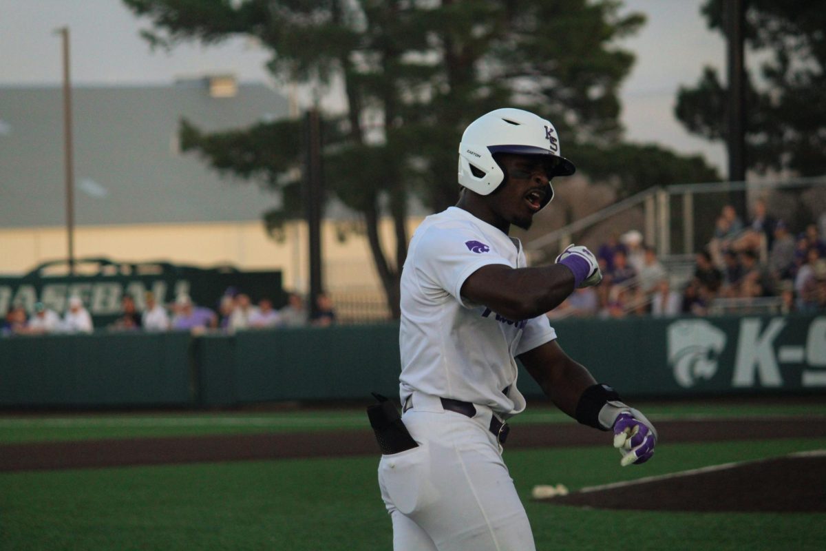 Dee Kennedy turns to the K-State dugout to give a celebration. Kennedy now has four home runs in his last two games as he homered in the third inning, which tied the game at 3-3. The Wildcats would take the win 7-5.