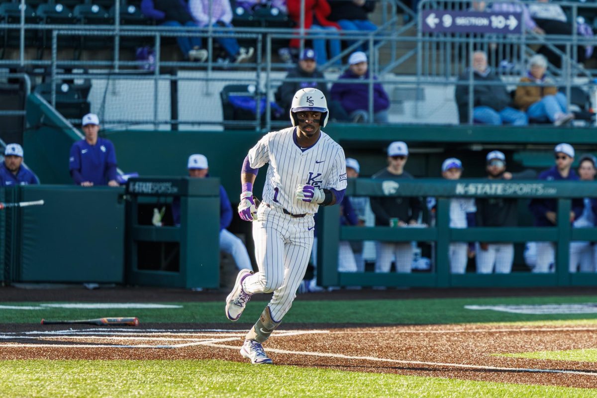 Shortstop Dee Kennedy (1) sprints toward first base. Kennedy finished the game with 2 hits, helping the Wildcats push their lead over SIUE. 
