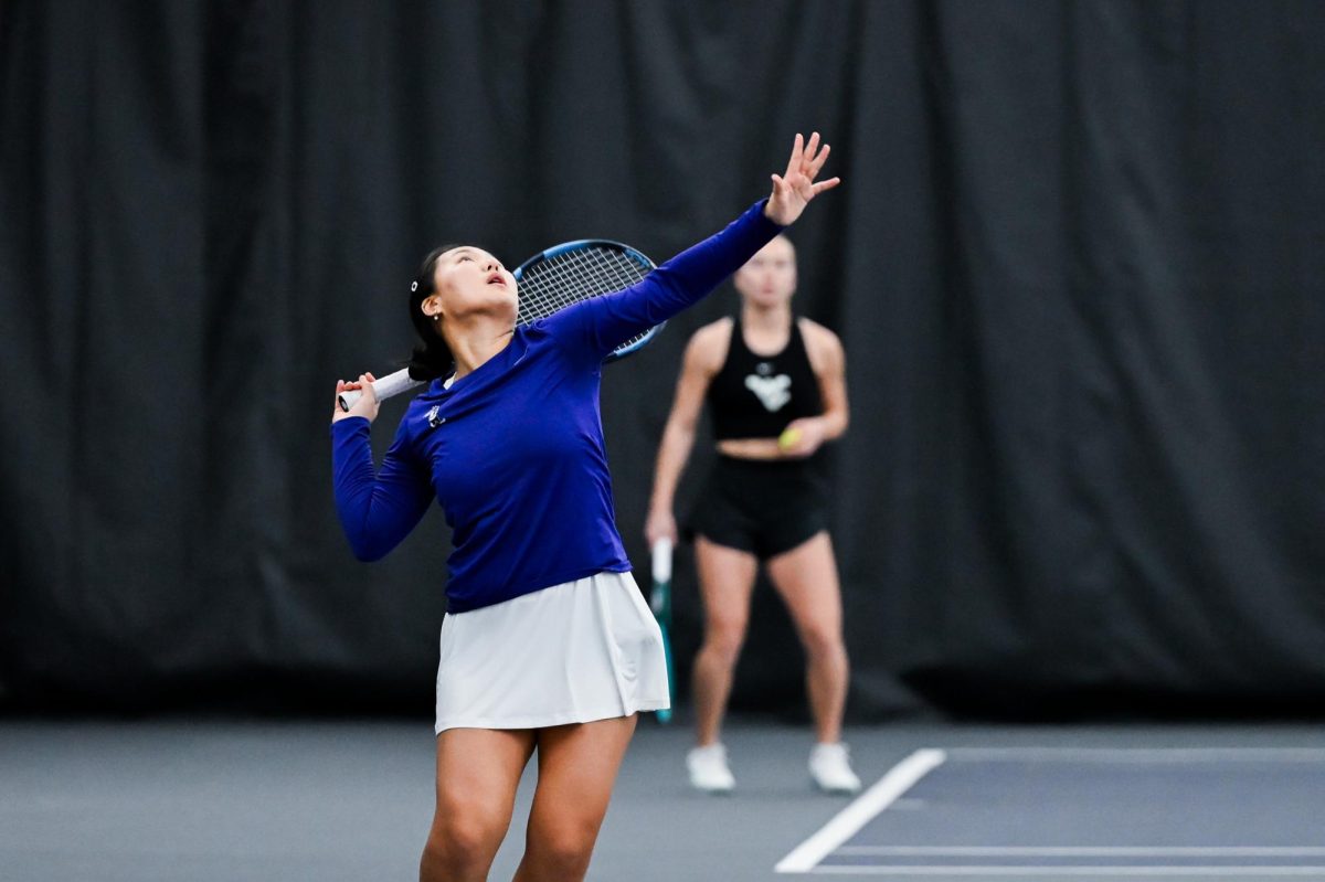 Freshman Martaa Chogsomjav serves the ball to her West Virginia opponent. She collected four straight victories out of the five-match stand on March 1. 
