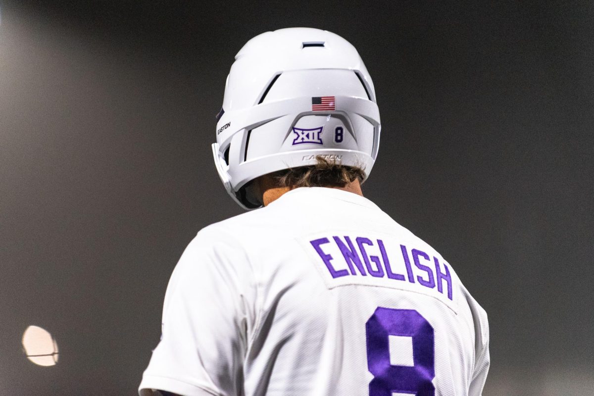Designated Hitter Nick English (8) stands on deck in the bottom of the 6th of the Big XII Opener against Utah on March 14, 2025.