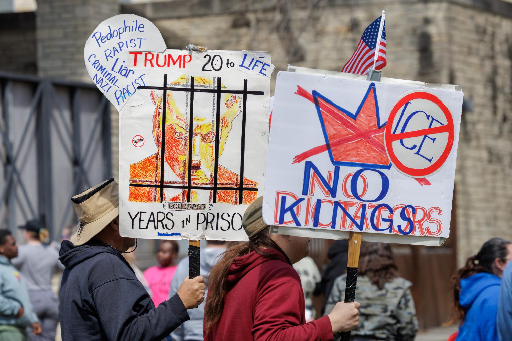 Protesters move toward Pointz Avenue after gathering at the Larry Norvell Band Shell in City Park during the March 28, “No Kings” protest. 