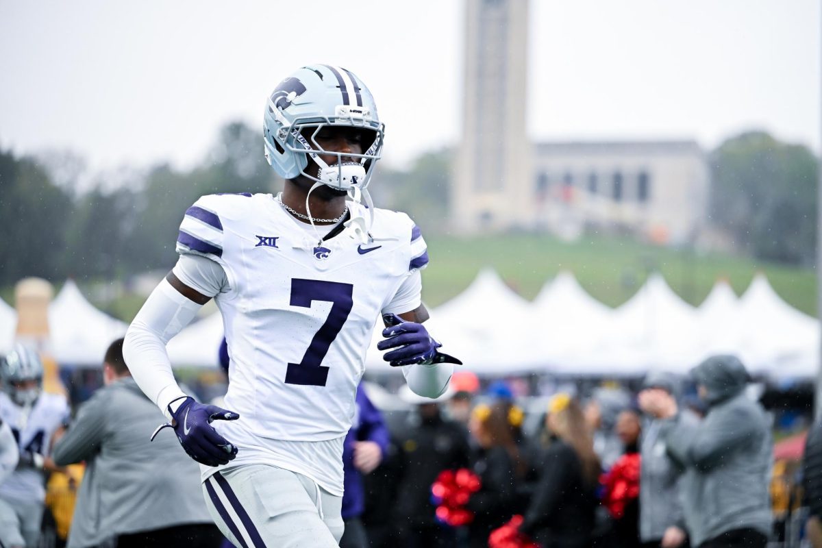 Safety VJ Payne (7) runs onto the field before the 2025 Sunflower Showdown at David Booth Memorial Stadium. 