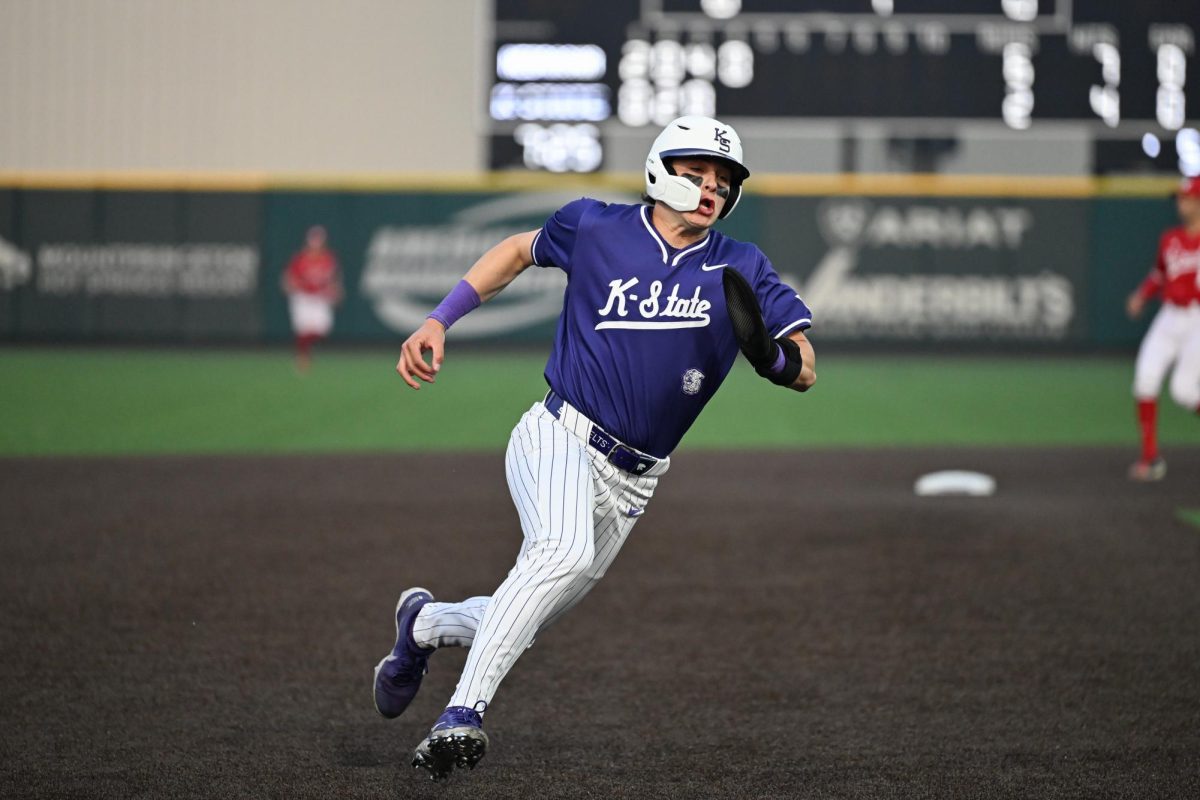 Ty Smolinski sprints around the corner of third base after a good hit by a teammate. The 'Cats fell to the Cornhuskers 14-9 on March 24. 