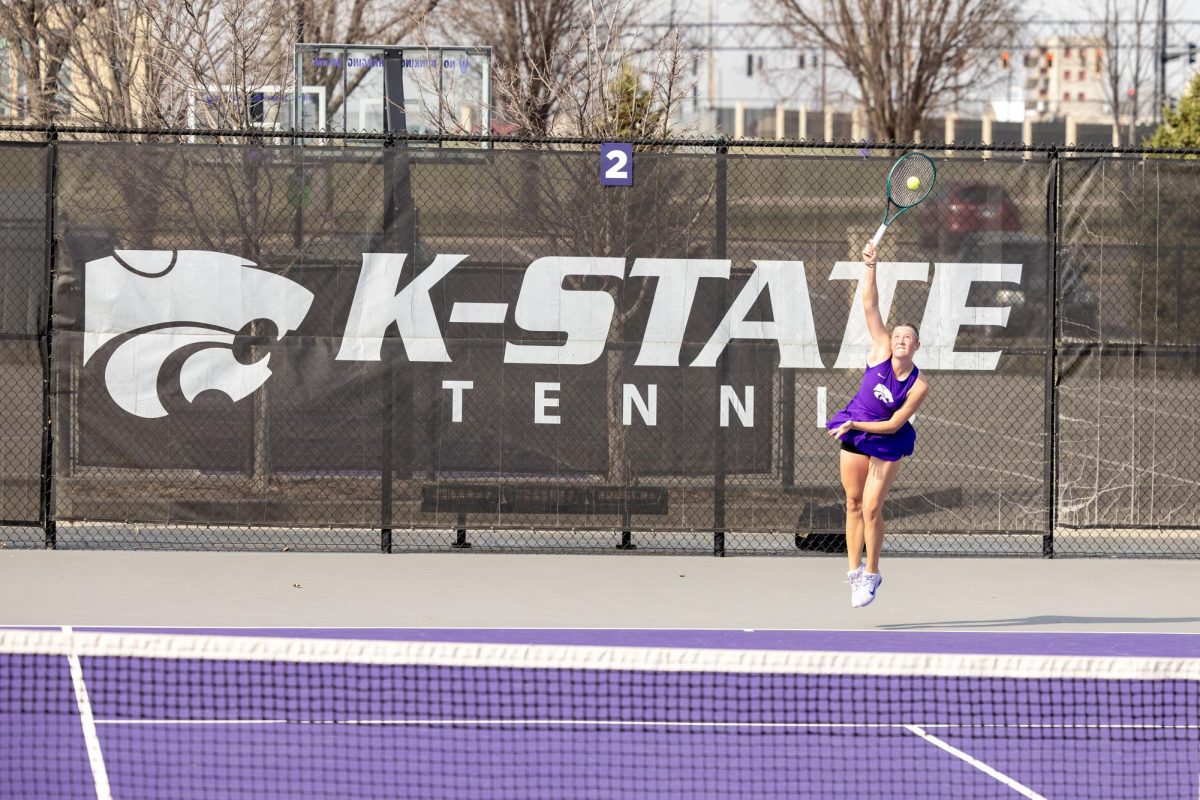 Varvara Bernovich tosses a serve during Kansas State’s 4–2 loss to Baylor at Mike Goss Tennis Stadium on March 20. The freshman won her sixth singles match 6–3, contributing one of the Wildcats’ two points. 