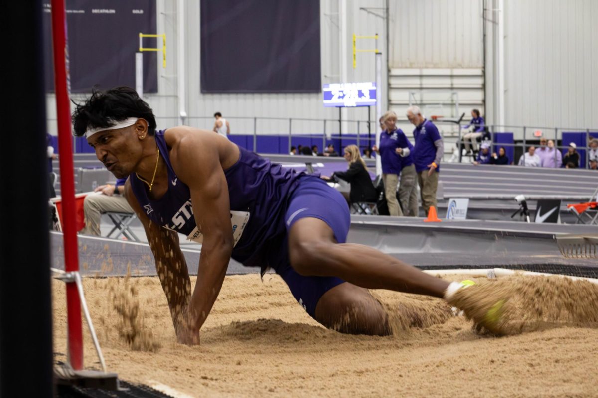 Long jumper Selva Prabhu crashing into the sand after a long jump attempt at the DeLoss Dodds Invitational