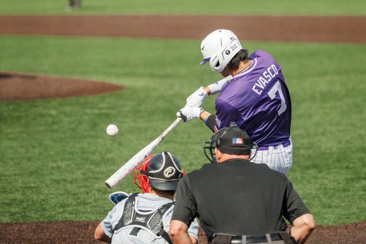 AJ Evasco (7) swings at a pitch during K-State's game against the Cincinnati Bearcats baseball on Saturday, May 9 at Tointon Family Stadium.