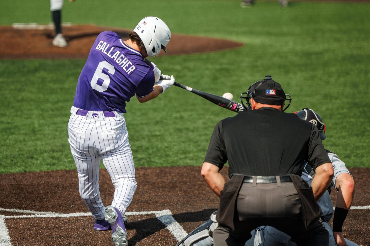 Grant Gallagher connects with a pitch during K-State's game against the Cincinnati Bearcats on Saturday, May 9 at Tointon Family Stadium.