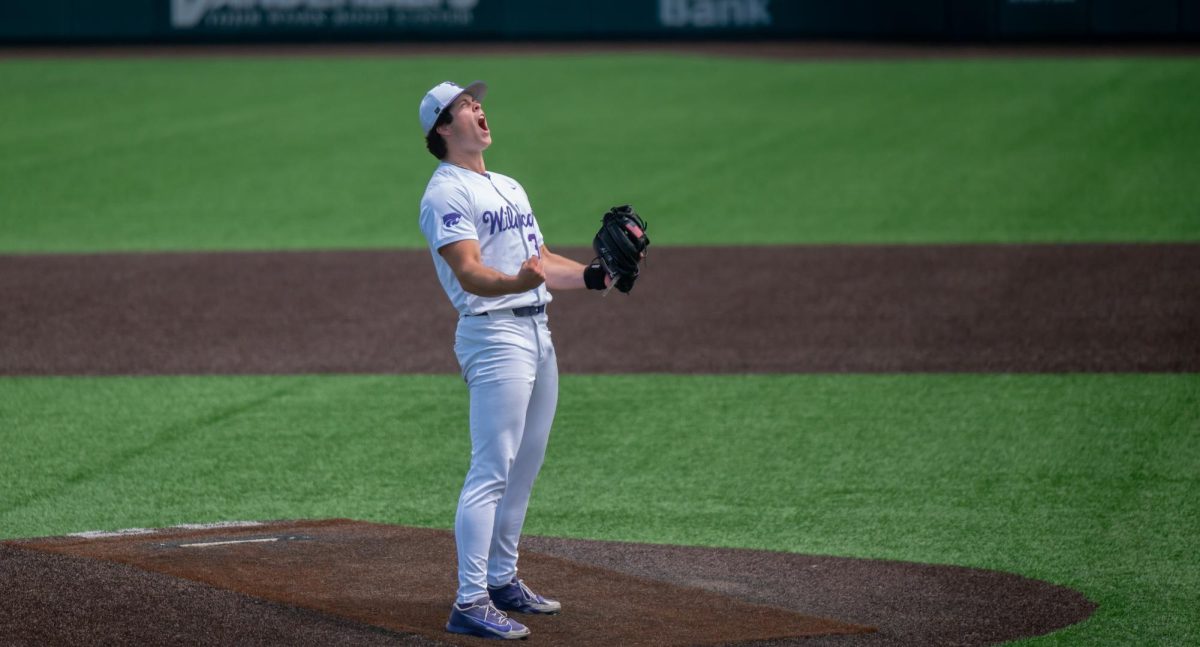 James Guyette (32) screams and pumps his arms after recording his 13th strikeout to complete his first career complete game in K-State’s 5-2 win over Cincinnati on May 10. 
