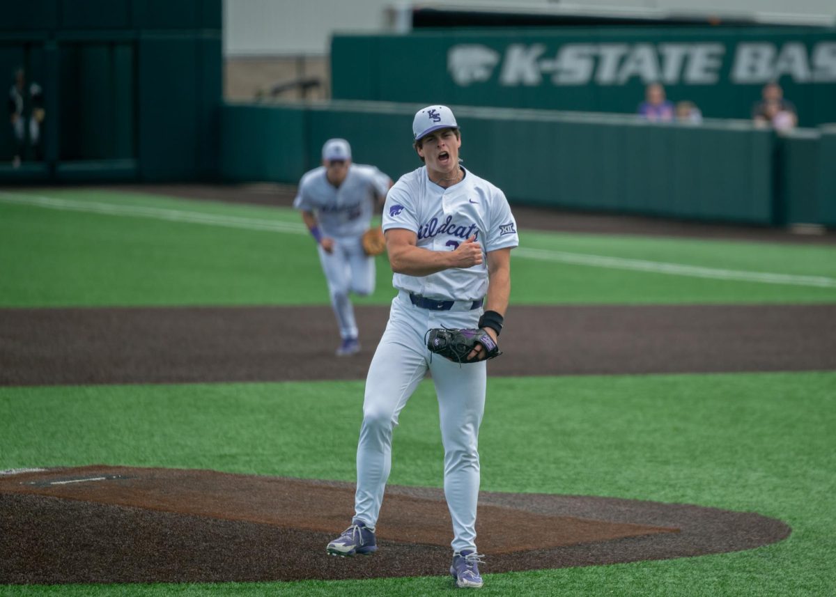 James Guyette (32) bangs his chest after recording his 12th strikeout to end the eighth inning in K-State’s 5-2 win over Cincinnati on May 10. 