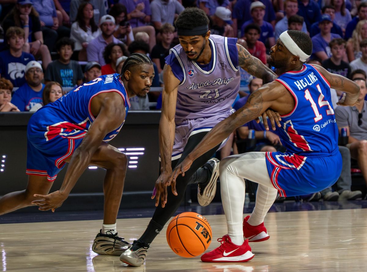 Cartier Diarra (21), weaves through defenders on his way to the basket during Purple Reign's TBT game against JHX Hoops at Bramlage Coliseum in Manhattan on July 21. 