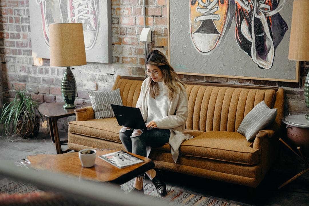 A person browsing an online store on a laptop at home