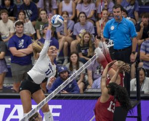 K-State’s Skylar Brady (11) pounds the ball during the Wildcats’ 3-0 exhibition win over Oklahoma on Aug. 22.