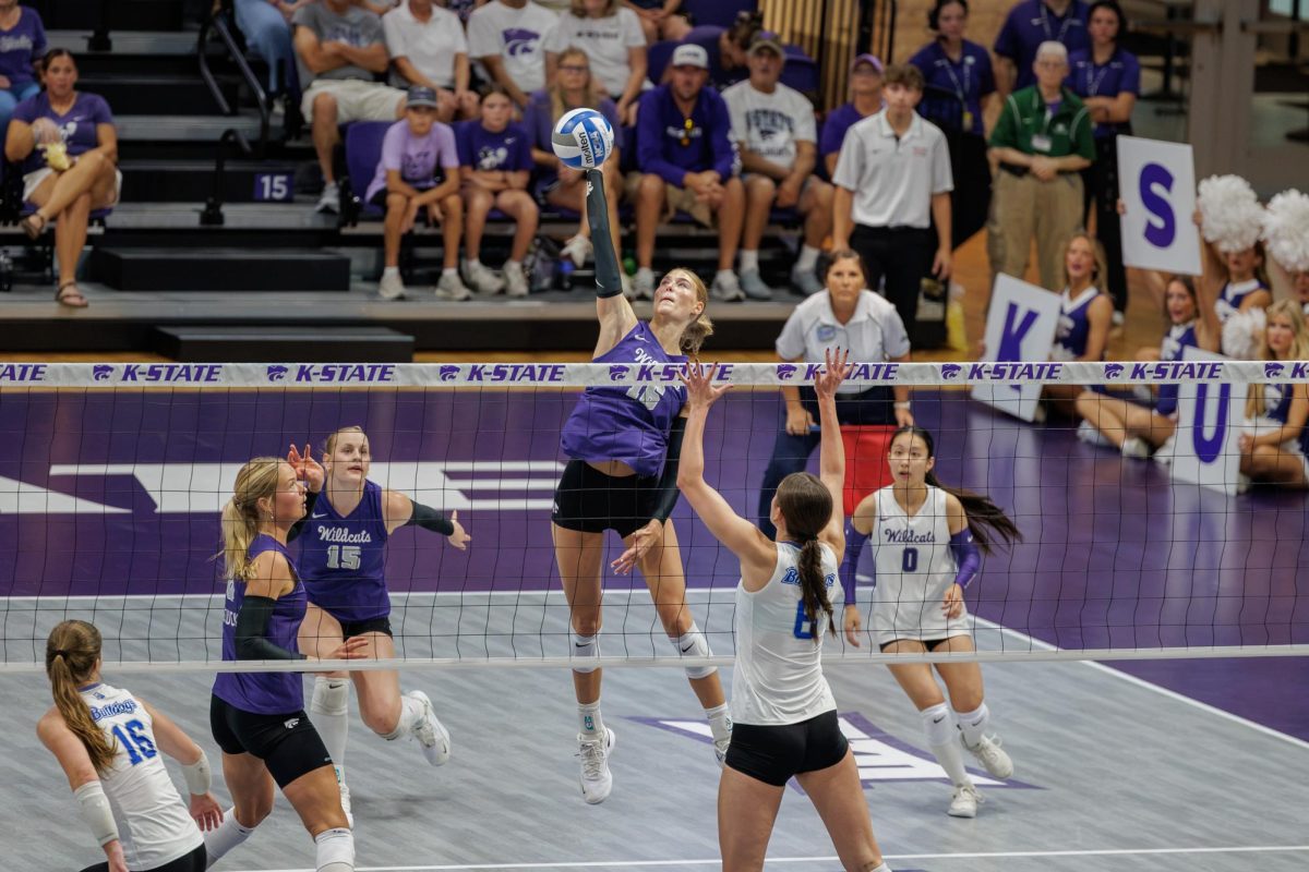 Cadence Lundgren jumps to set up an attack over the net during the Wildcats' match against Drake at Morgan Family Arena on Sep. 6. 