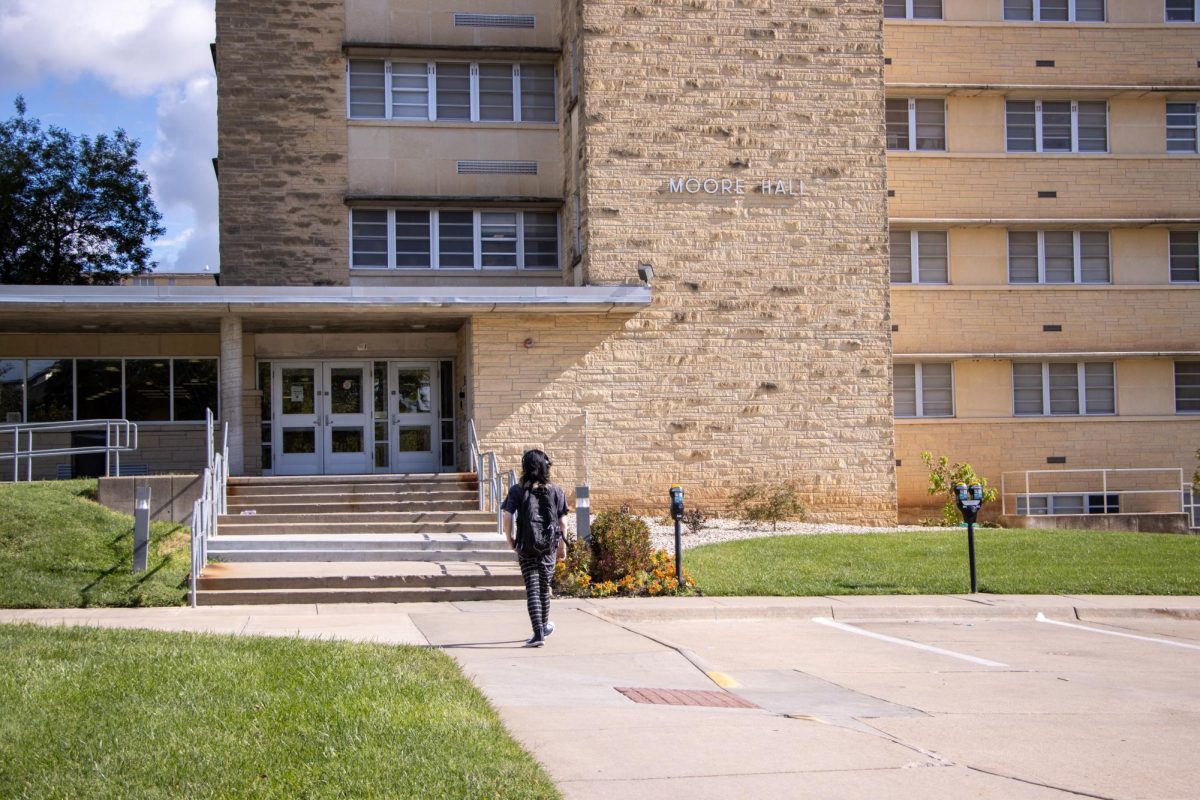 A student walks toward the entrance of newly renovated Moore Hall on Sept. 2. All wings are now open since major renovations have been completed.