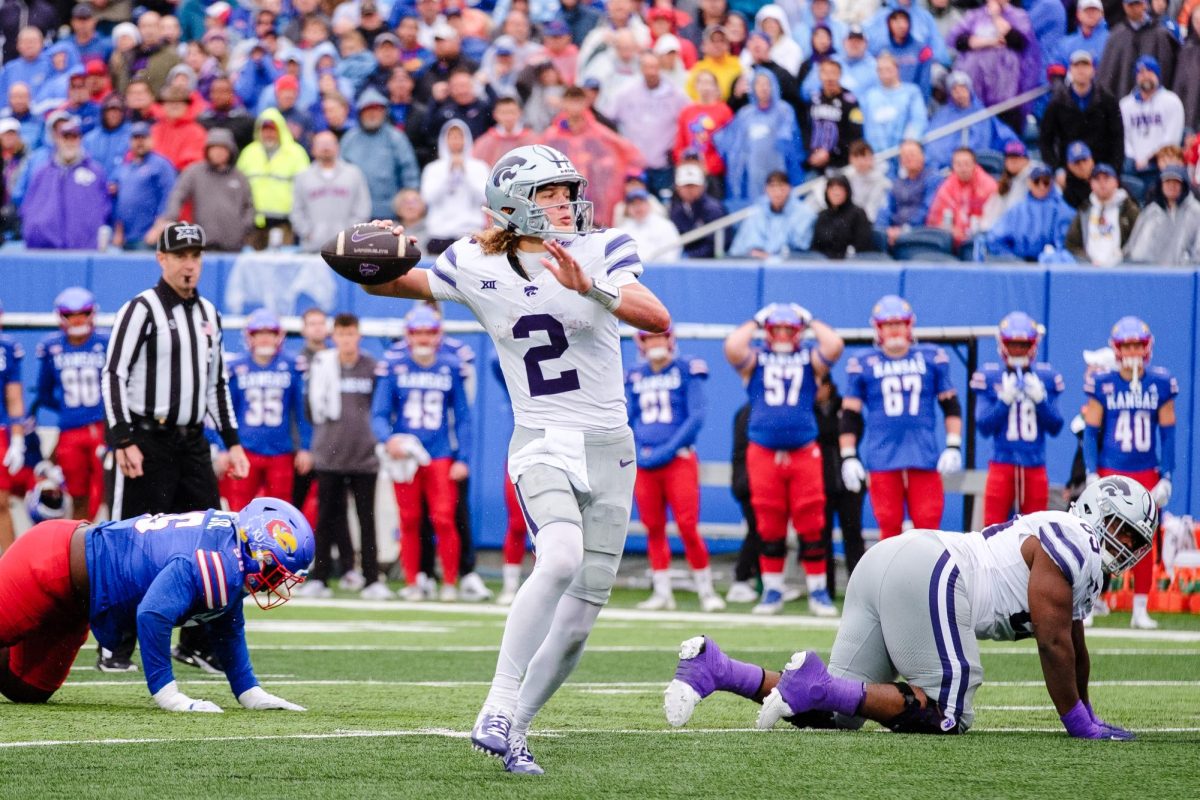 K-State quarterback Avery Johnson (2) rears back for a pass after evading a sack by the Jayhawks in the 42-17 victory at David Booth Memorial Stadium on October 25, 2025.