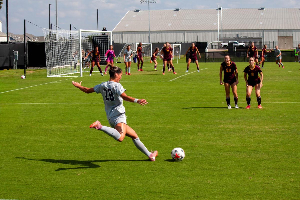 Forward Gabby Demers rears back to kick the ball past Arizona State's defense to keep the attack alive. K-State lost 2-0 to the Sun Devils, marking the team's second loss of the season.