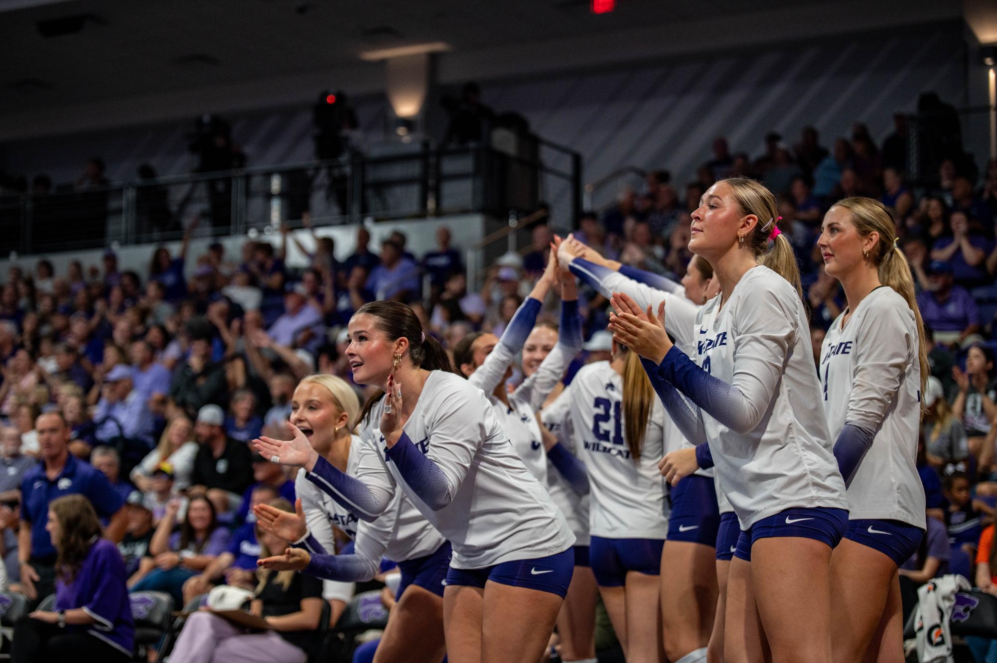 The K-State volleyball team celebrates after scoring a point during the first set against Houston. The Wildcats lost this first sent 25-23.