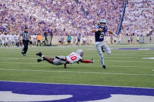 Quarterback Avery Johnson (2) breaks a tackle before bursting into the endzone for a touchdown against Nicholls on September 5. K-State's potent offense would drop ten touchdowns in the 71-3 victory to debut the 2026 season. 