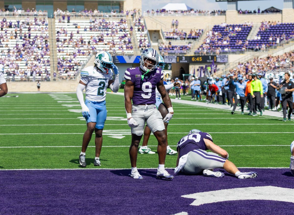Jay Harris (9) celebrates after recording one of his two rushing touchdowns in K-state's 31-20 win over Tulane. Harris transferred to K-state from Oregon where he played in 11 games and had 151 rushing yards and two touchdowns.