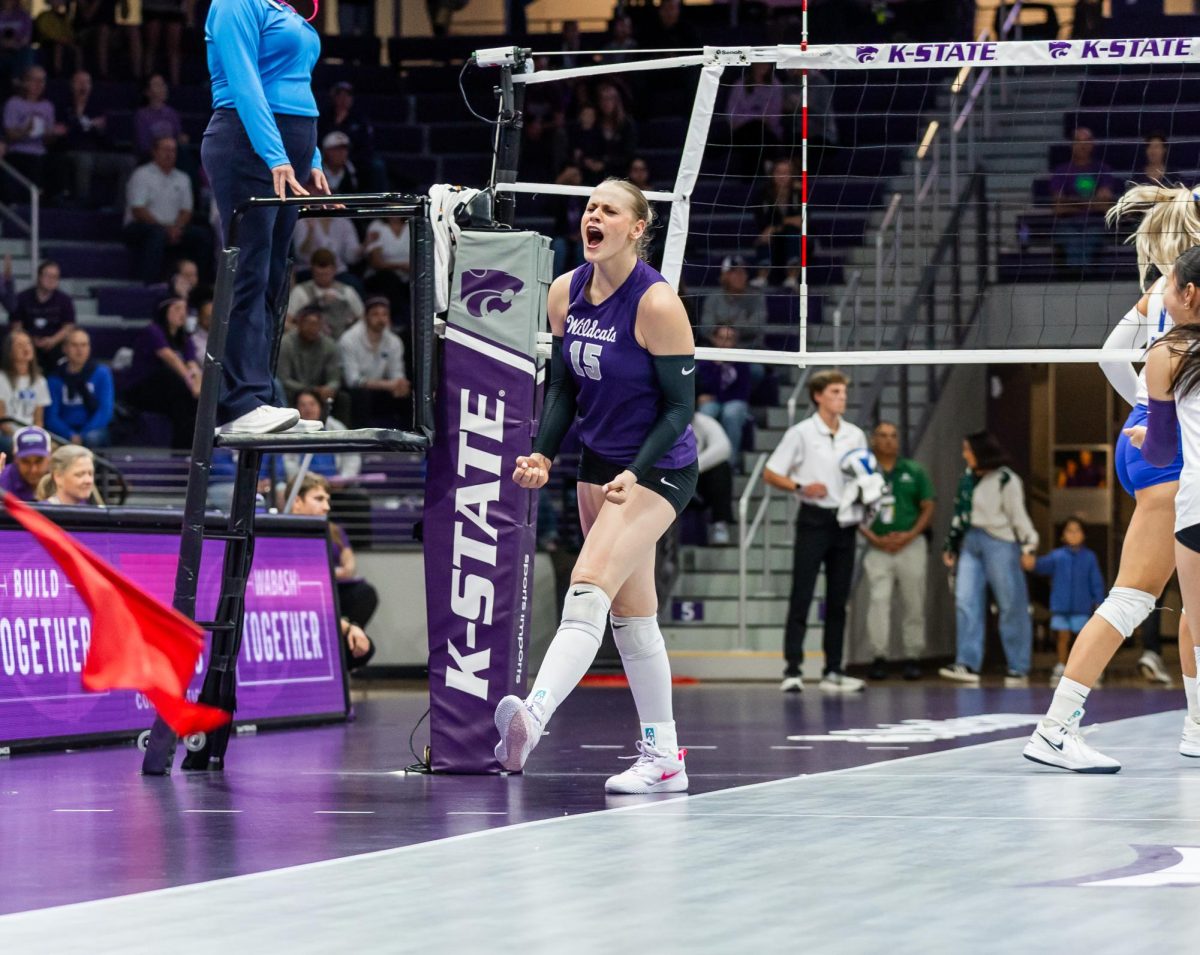 After completing a kill, Addison Massey celebrates. Massey recorded 23 kills in the match. The Wildcats fell to BYU 1-3 on Oct. 1 at Morgan Family Arena.