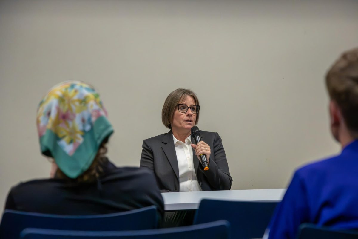 Jennifer Lloyd answers a question during the Indivisible MHK town hall at the Manhattan Public Library on Oct. 20. Lloyd is a candidate for the Kansas State Department of Education.