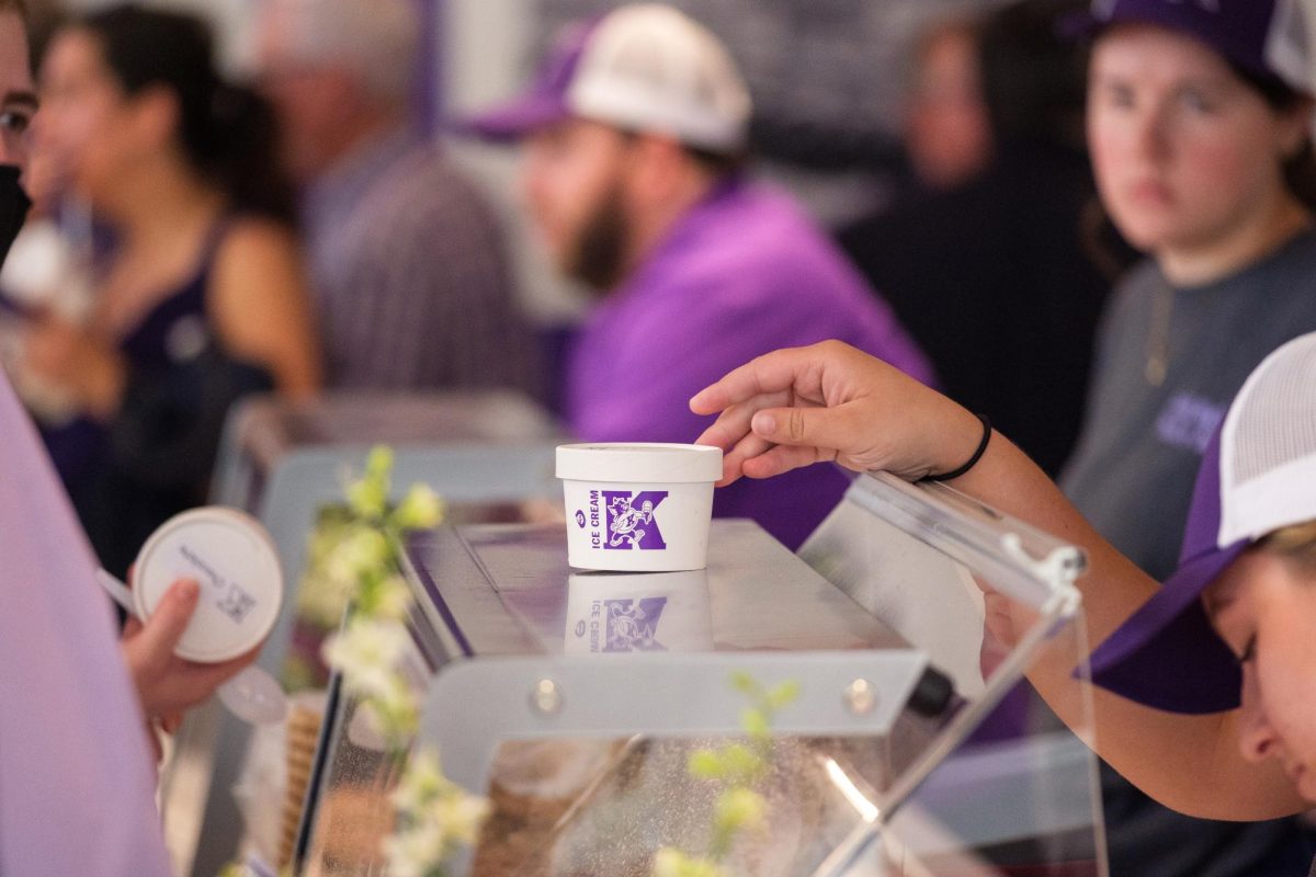 A cup of K-State’s Call Hall ice cream is handed out following the Western Star Global Grain and Food Center opening ceremony on Sept. 18. The facility replaces the former Call and Weber halls, furthering advancements in food sciences. 