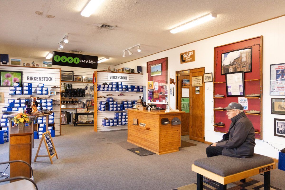 Eddie Olson sits in his store that has been family owned and operated for generations since 1889.