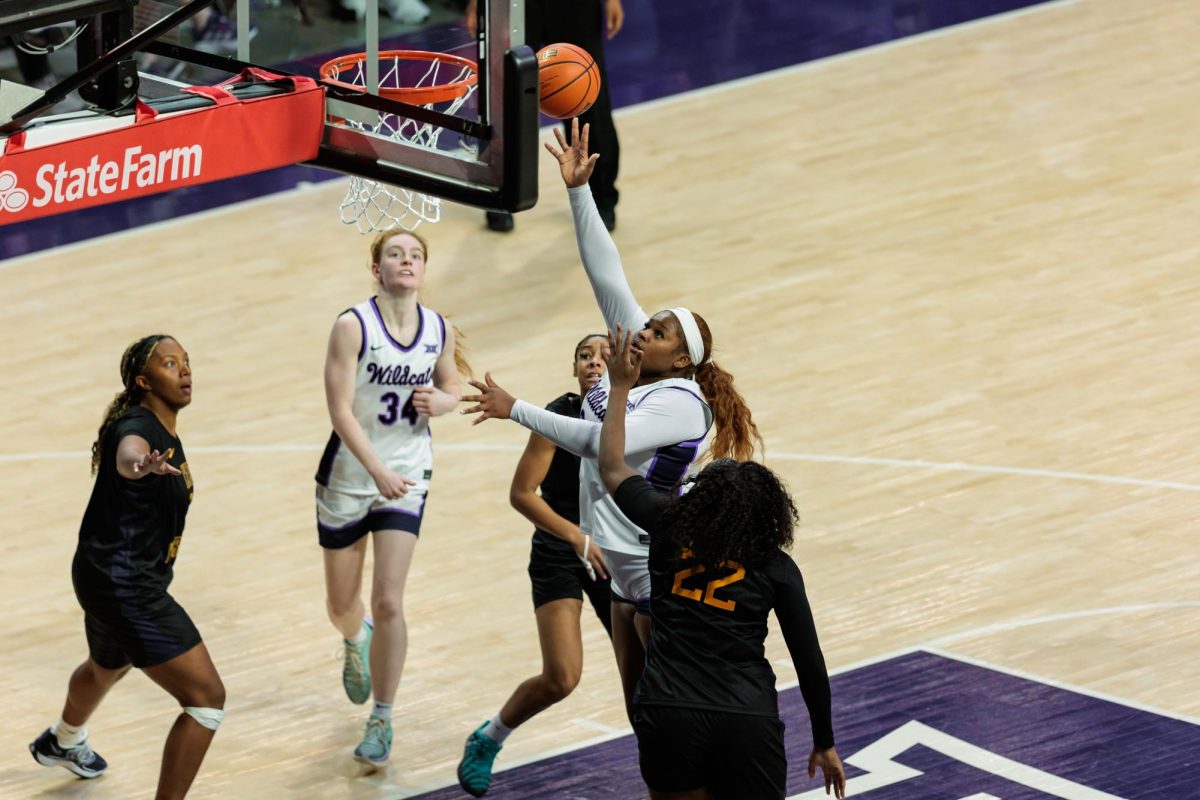 K-State center Ramiya White (22) shoots during the basketball game against West Virginia on Jan. 4 at Bramlage Coliseum in Manhattan. 