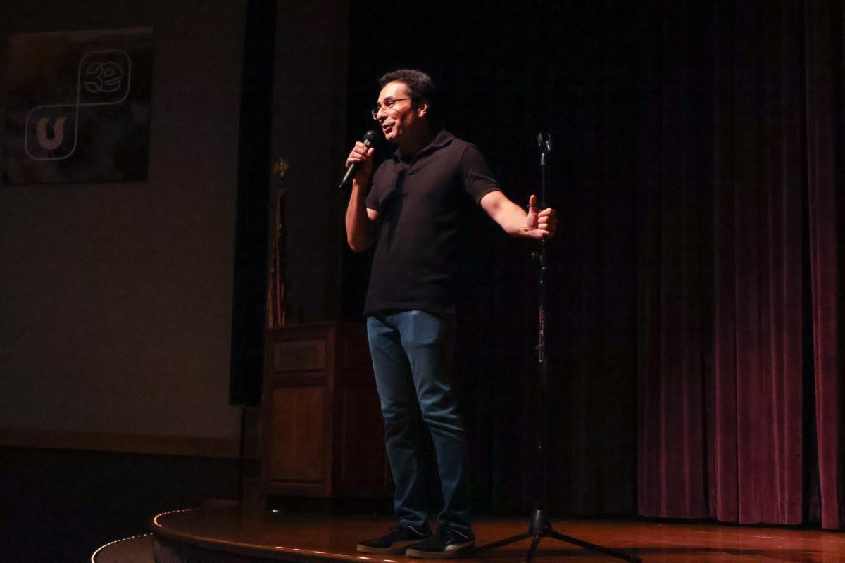Comedian Saad Haroon performs crowd work during his comedy set at the Comedy Show & Fundraising Night. The Pakistan Student Association organized the night at the Student Union on Oct. 8.