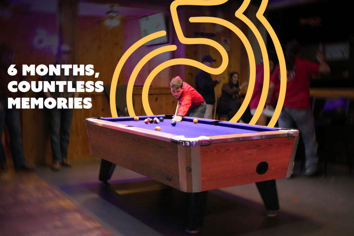 A Three Brother's Bar attendee takes a shot during a game of pool on Oct. 19. The bar has an 18-plus side, along with a 21-plus section to accommodate patrons of all ages. (Photo by Henry Pfannestiel)