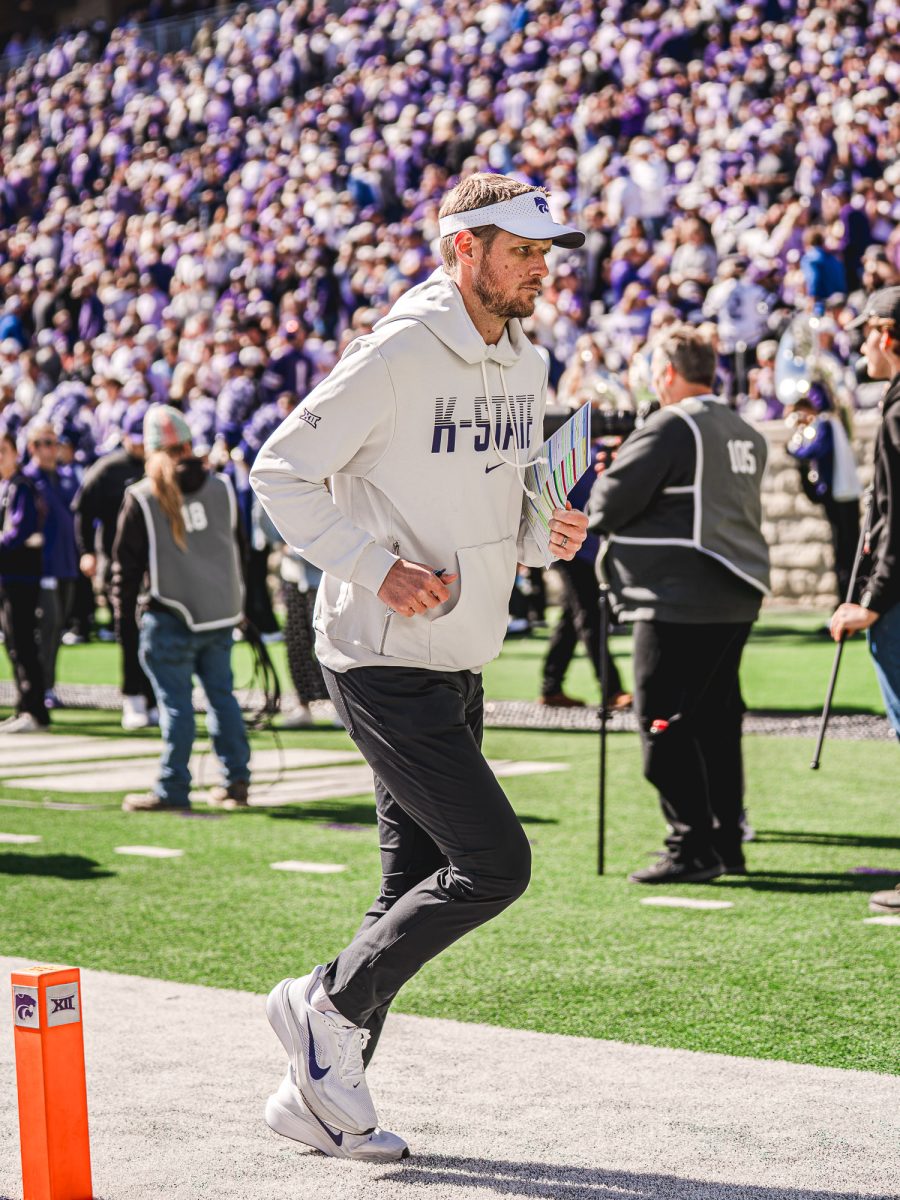 K-State head coach Collin Klein runs across the field at the Dillons Sunflower Showdown on Oct. 17 at Bill Snyder Family Stadium. 