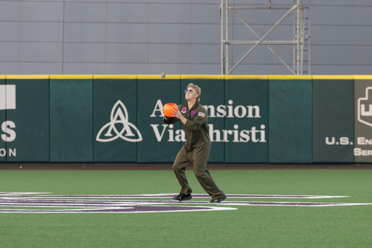 Dressed as Goose from "Top Gun," sophomore Jack Quetschenbach catches the ball using a trick-or-treat basket.