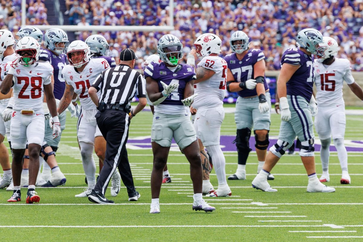 K-State running back Joe Jackson (4) celebrates a successful play during the Wildcats’ 34-7 victory over Washington State on Sept. 12 at Bill Snyder Family Stadium. Jackson finished the game with 68 net rushing yards. 