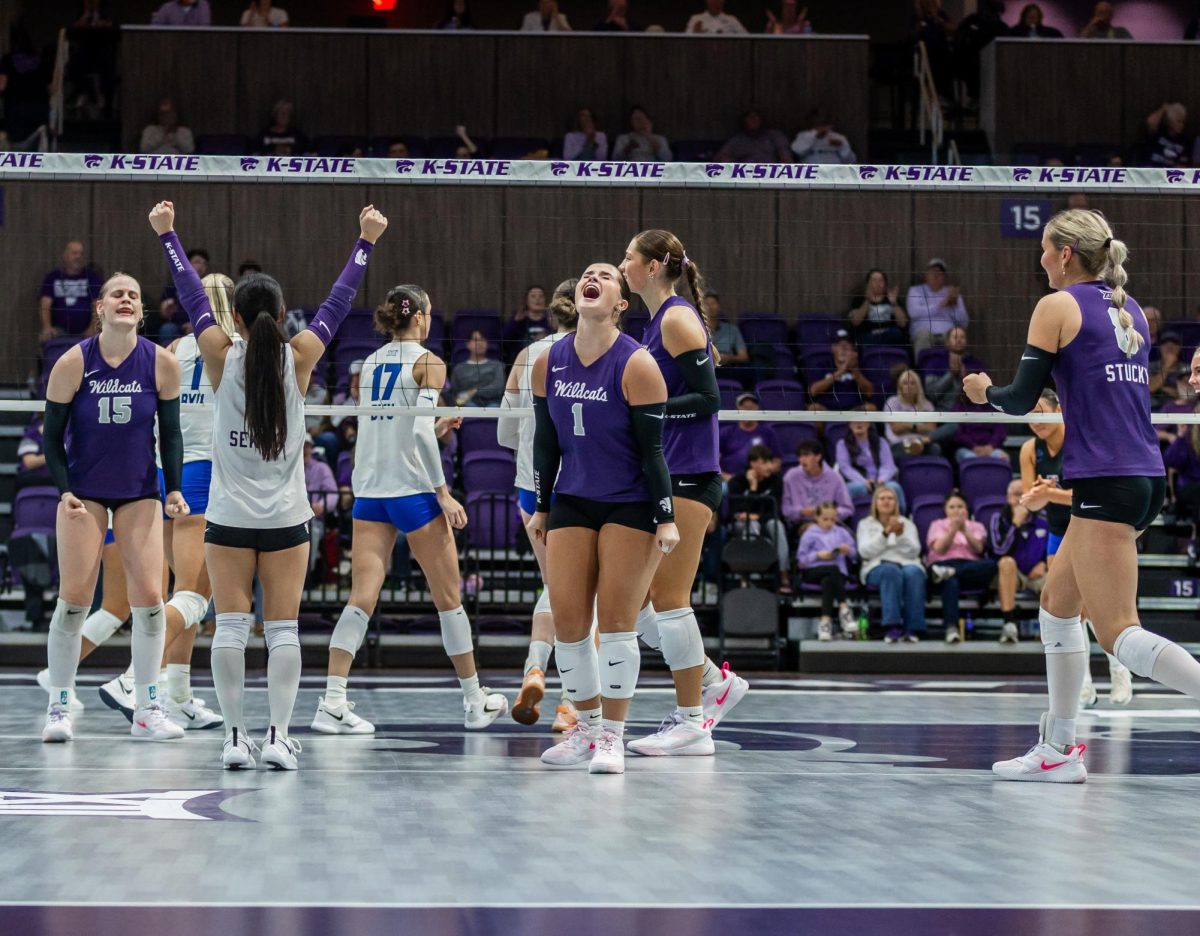 Caleigh Ponn celebrates a successful point against the Cougars. Ponn recorded one assist. The Wildcats fell to BYU 1-3 on Oct. 2.