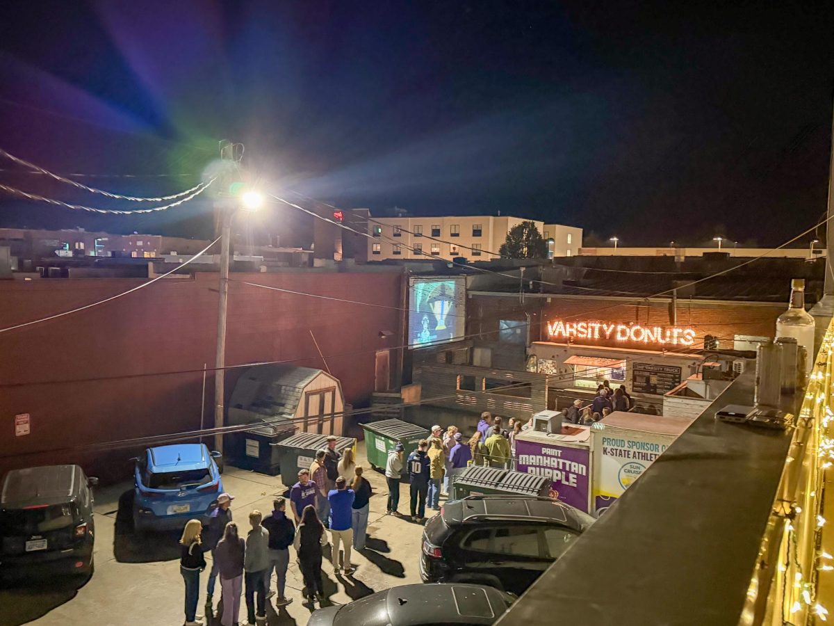 The view from an apartment looking out over the Varsity Donuts truck in Aggieville