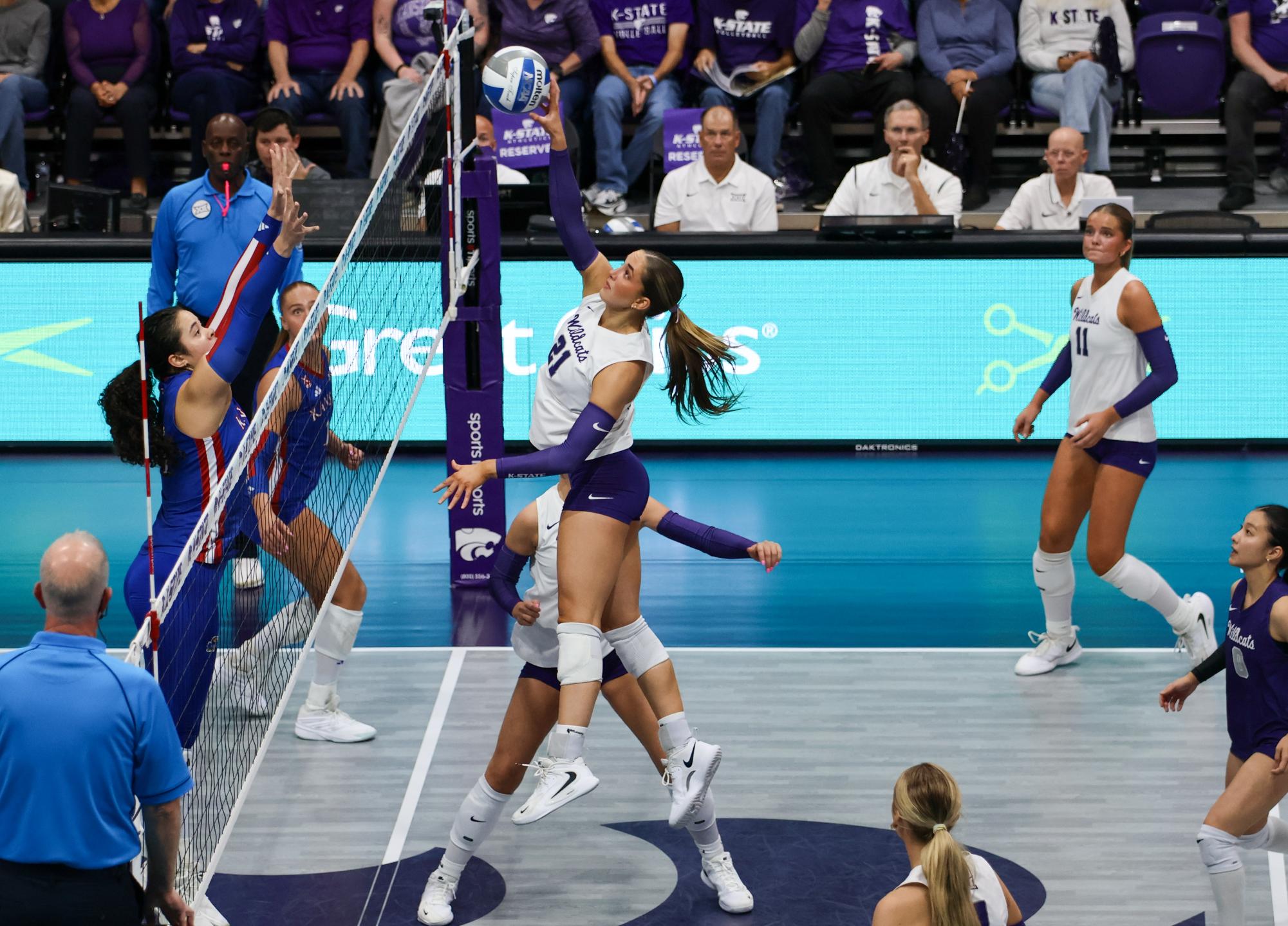 Freshman Reese Resmer tips the ball back to KU at the Sunflower Showdown on Oct. 15.  Resmer has started in 5 matches this season. 