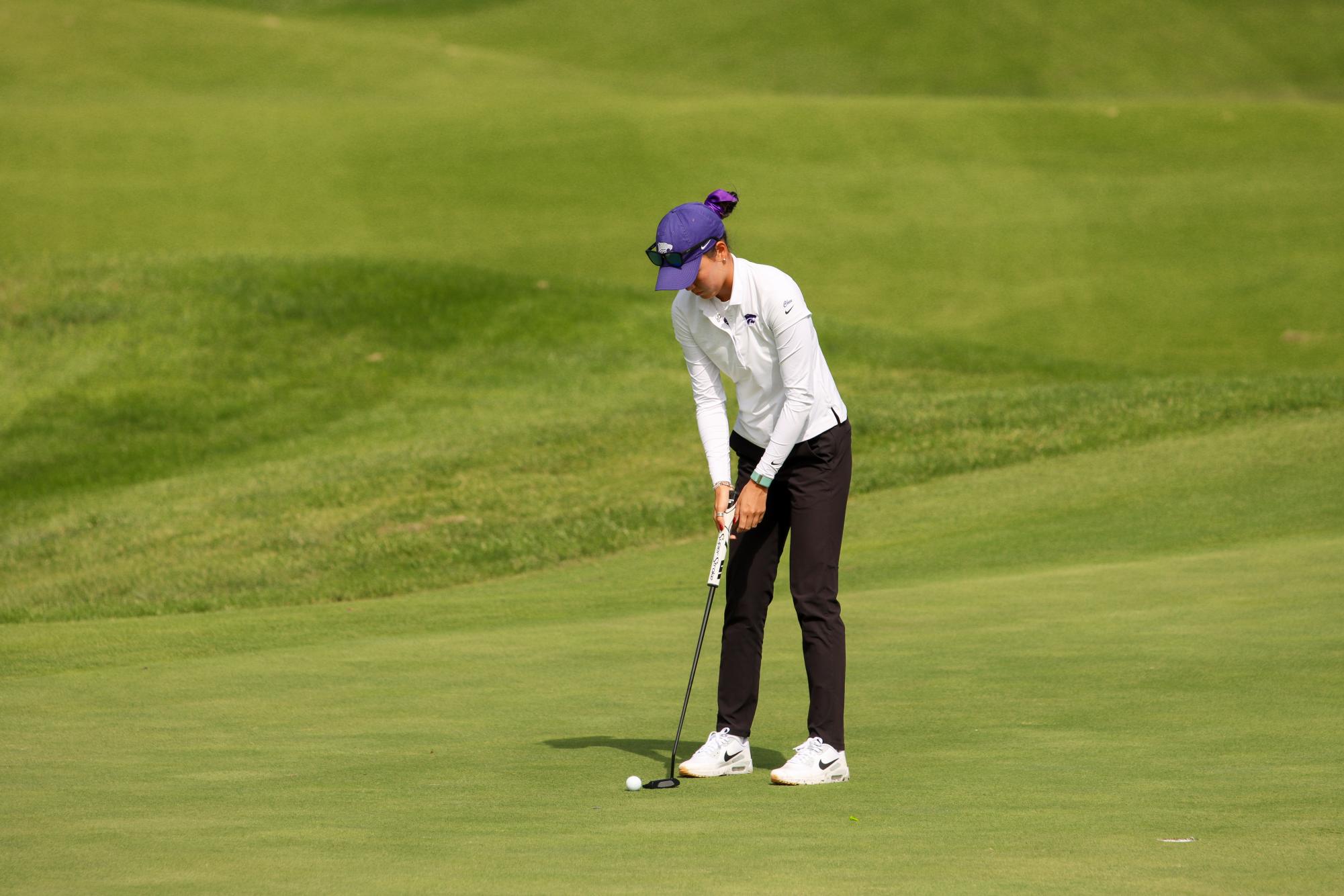 Kelsey Chen, a junior, lines up a putt during the PowerCat Classic tournament on Sept. 28 at Colbert Hills. Chen set a new school record 54-hole score of 15-under par, 201.

