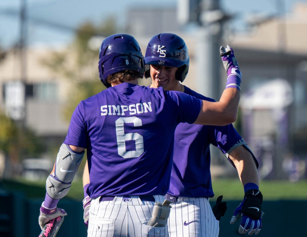 Cadyn Karl (2) celebrates his homerun with his teammate Maddix Simpson (6). Karl is returning for his 4th year at K-State.